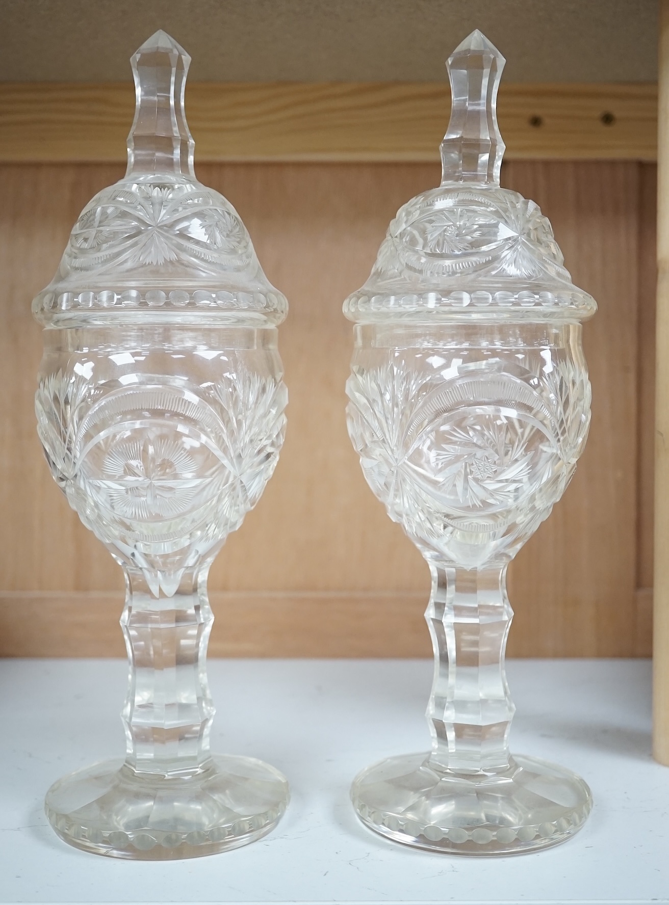 A pair of Bohemian glass sweetmeat vases and covers, 31cm. Condition - fair